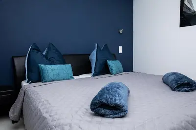 Ein Bett oder Betten in einem Zimmer der Unterkunft Vladys Vienna Apartments