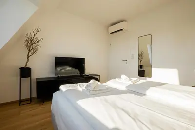 Ein Bett oder Betten in einem Zimmer der Unterkunft OrestaLiving - Penthouse with designer renovation