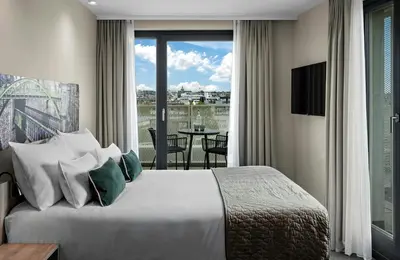 Ein Bett oder Betten in einem Zimmer der Unterkunft Leonardo Hotel Vienna City West
