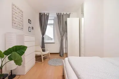 Ein Bett oder Betten in einem Zimmer der Unterkunft Spacious central apartment