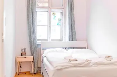 Ein Bett oder Betten in einem Zimmer der Unterkunft Simple 3BR Apartment Near Wiener Stadthalle