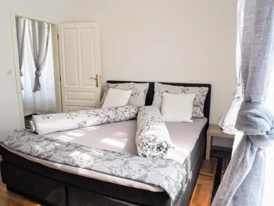 Ein Bett oder Betten in einem Zimmer der Unterkunft City Villa Schönbrunn Apartments - Contactless 24h Check-In