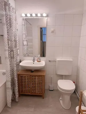 Ein Badezimmer in der Unterkunft Cozy City Apartment