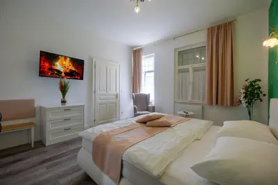 Ein Bett oder Betten in einem Zimmer der Unterkunft Albizia-Apartments