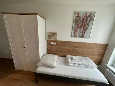 Ein Bett oder Betten in einem Zimmer der Unterkunft Lion`s Rooms n Apartments