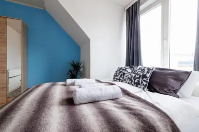 Ein Bett oder Betten in einem Zimmer der Unterkunft Cozy Apartment near Center