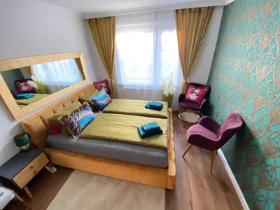 Ein Bett oder Betten in einem Zimmer der Unterkunft Royal Apartment