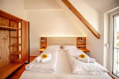 Ein Bett oder Betten in einem Zimmer der Unterkunft DASWEINBERG contactless check-in