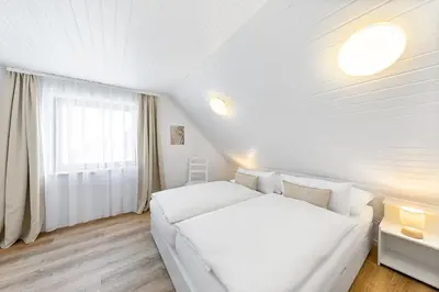 Ein Bett oder Betten in einem Zimmer der Unterkunft Landhaus Rust