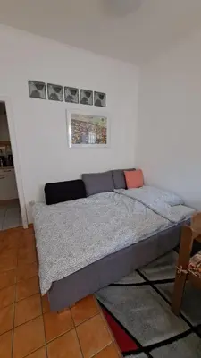 Ein Bett oder Betten in einem Zimmer der Unterkunft Haus Piroschka