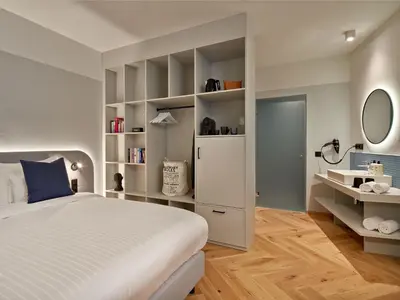 Ein Bett oder Betten in einem Zimmer der Unterkunft URBANAUTS STUDIOS Fillgrader
