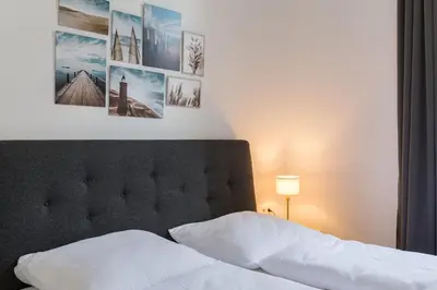 Ein Bett oder Betten in einem Zimmer der Unterkunft Grand Viennese Residence