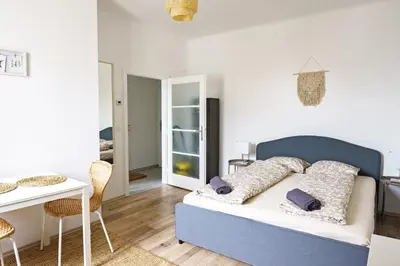 Ein Bett oder Betten in einem Zimmer der Unterkunft Vienna City Apartment Südtiroler Platz
