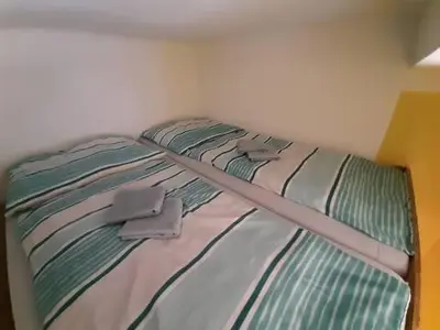 Ein Bett oder Betten in einem Zimmer der Unterkunft Relaxrooms Vienna Hernals